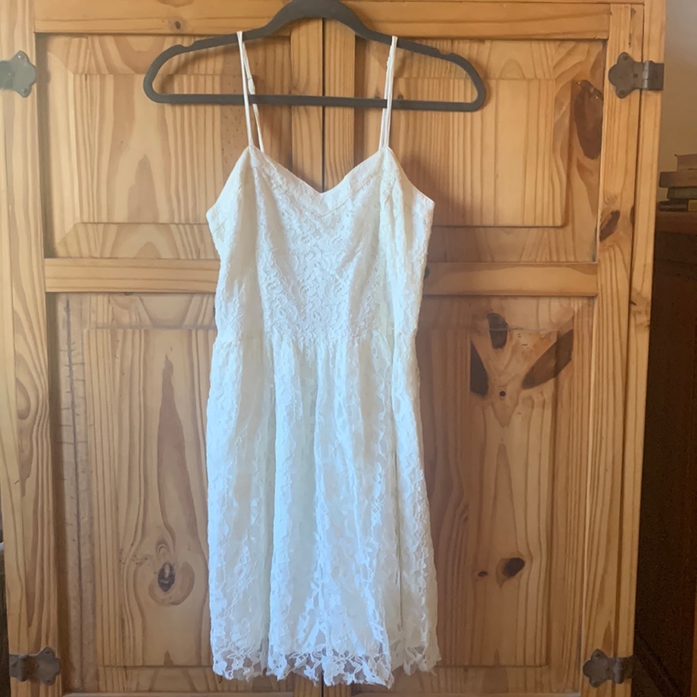 Cream colored, lace overlay dress.